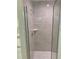 Modern shower with glass enclosure and gray tile at 6435 Sw 204 Ave, Dunnellon, FL 34431