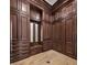 Spacious walk-in closet with wood cabinetry, shelving, drawers, and a bench at 8570 Nw 31St Lane Rd, Ocala, FL 34482