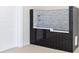 Modern dog shower featuring black tile, decorative backsplash and chrome fixtures at 8570 Nw 31St Lane Rd, Ocala, FL 34482
