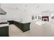 Spacious open concept features a kitchen and living room with a fireplace and large windows at 8570 Nw 31St Lane Rd, Ocala, FL 34482