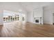 Living room featuring hardwood floors, a fireplace, and a large bank of windows at 8570 Nw 31St Lane Rd, Ocala, FL 34482