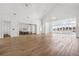 Hardwood floor living room with pool access and kitchen access at 8570 Nw 31St Lane Rd, Ocala, FL 34482