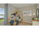 Bright bedroom with a charming bed frame, cute whale wall decor, and a window view at 2026 Babbling Brook Blvd, Auburndale, FL 33823