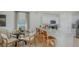 Modern kitchen features a breakfast bar, stainless steel appliances, and an adjacent dining area at 2026 Babbling Brook Blvd, Auburndale, FL 33823