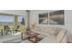 Cozy living room with a comfortable sectional sofa, decorative pillows, and a view of the outdoor patio at 2026 Babbling Brook Blvd, Auburndale, FL 33823