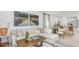 Inviting living space with a plush sofa, decorative accents, and an open layout connecting the kitchen and dining area at 2026 Babbling Brook Blvd, Auburndale, FL 33823
