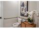 Accessible bathroom with handrails, a modern toilet, and decorative accents enhancing the space at 2136 Babbling Brook Blvd, Auburndale, FL 33823