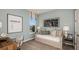 Comfortable bedroom with neutral tones, a cozy daybed, and decor that enhances the space at 2136 Babbling Brook Blvd, Auburndale, FL 33823