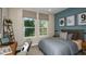 Cozy bedroom with natural light, a comfortable bed, and stylish decor creating a relaxing atmosphere at 2136 Babbling Brook Blvd, Auburndale, FL 33823