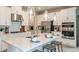 Bright, modern kitchen with stainless appliances, a center island, pendant lights, and ample cabinet space at 2136 Babbling Brook Blvd, Auburndale, FL 33823