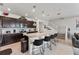 Spacious kitchen featuring a granite island and stainless steel appliances next to the stairs at 921 Paradise Dr, Davenport, FL 33897