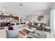 Bright living room open to kitchen with modern finishes and stainless steel appliances at 921 Paradise Dr, Davenport, FL 33897