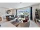 Inviting living room featuring a large slider to the screened in lanai and pool area at 921 Paradise Dr, Davenport, FL 33897