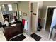 Bright bathroom featuring modern vanity, white tiled shower, and well-lit space at 4622 Warrington Dr, Orlando, FL 32826