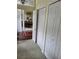 Entryway hallway with closet space leading into the dining room featuring hardwood floors and natural lighting at 4622 Warrington Dr, Orlando, FL 32826