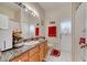 Bathroom featuring tile floors, granite countertops, and a shower-tub combination at 603 Pinehurst Ct, Kissimmee, FL 34758