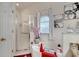Bathroom featuring an enclosed stand-up shower, soaking tub and decor at 603 Pinehurst Ct, Kissimmee, FL 34758