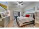 Comfortable bedroom with a ceiling fan, neutral walls, and a sliding door to the backyard at 603 Pinehurst Ct, Kissimmee, FL 34758