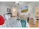 This bedroom offers an ensuite bathroom, ceiling fan, television, and neutral decor at 603 Pinehurst Ct, Kissimmee, FL 34758