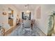 Elegant dining room featuring a decorative chandelier, a large table, and seating for six at 603 Pinehurst Ct, Kissimmee, FL 34758