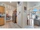A view of the entryway and dining area; stainless steel refrigerator in the kitchen at 603 Pinehurst Ct, Kissimmee, FL 34758
