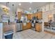 The kitchen features stainless steel appliances, tile backsplash and countertops at 603 Pinehurst Ct, Kissimmee, FL 34758