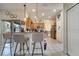 Open-concept kitchen with stainless appliances and breakfast bar with seating at 603 Pinehurst Ct, Kissimmee, FL 34758