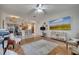 Open-concept living room with views of the kitchen and dining area at 603 Pinehurst Ct, Kissimmee, FL 34758