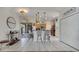 Open-concept dining space and kitchen with access to a covered patio at 603 Pinehurst Ct, Kissimmee, FL 34758