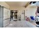 Well-lit and spacious screened patio equipped with a stainless steel refrigerator and dining space at 603 Pinehurst Ct, Kissimmee, FL 34758