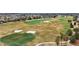 An aerial view of the golf course in the community with ponds and sand traps at 2378 Ridgeway Ct, The Villages, FL 32162