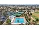 An aerial view of a pool, pickleball courts and tennis courts at the community center at 2378 Ridgeway Ct, The Villages, FL 32162