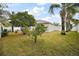 The private backyard featuring mature trees and well-maintained landscaping at 2378 Ridgeway Ct, The Villages, FL 32162