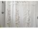 Bathroom curtain with floral decorations at 2378 Ridgeway Ct, The Villages, FL 32162