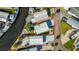 Aerial view of property lines surrounding a light gray home near waterfront canals and neighborhood streets at 9000 Us Highway 192 # 242, Clermont, FL 34714