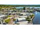 Aerial view of waterfront community, lush landscapes, and tranquil canals at 9000 Us Highway 192 # 242, Clermont, FL 34714