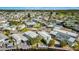 Expansive aerial view showcasing a dense residential neighborhood with diverse home styles and lush greenery, a beautiful community at 9000 Us Highway 192 # 242, Clermont, FL 34714