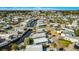 Beautiful aerial view of neighborhood with homes nestled along winding canals and lush landscaping, offering scenic waterfront living at 9000 Us Highway 192 # 242, Clermont, FL 34714