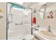 Bathroom featuring a walk-in shower with grab bars, a modern vanity, and clean finishes at 9000 Us Highway 192 # 242, Clermont, FL 34714