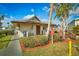 Exterior of the community clubhouse featuring well-maintained landscaping and inviting entrance at 9000 Us Highway 192 # 242, Clermont, FL 34714