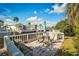Relax on the outdoor deck with a dining table and chairs overlooking the beautiful waterfront at 9000 Us Highway 192 # 242, Clermont, FL 34714