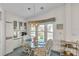 The dining area features a glass table, comfortable seating, and lots of natural light at 9000 Us Highway 192 # 242, Clermont, FL 34714