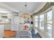 The dining area features a glass table, comfortable seating, and a scenic window view at 9000 Us Highway 192 # 242, Clermont, FL 34714