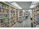 Well-lit community library featuring rows of bookshelves with a variety of reading materials at 9000 Us Highway 192 # 242, Clermont, FL 34714