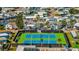 Aerial shot featuring meticulously maintained tennis courts surrounded by lush landscaping at 9000 Us Highway 192 # 242, Clermont, FL 34714