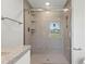 Bathroom with shower stall featuring stone look tile at 103 S Flagler Ave, Edgewater, FL 32132