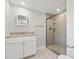 Updated bathroom with tiled shower and granite vanity at 103 S Flagler Ave, Edgewater, FL 32132