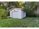 Exterior shot of the detached single car garage with white paint and a concrete foundation at 103 S Flagler Ave, Edgewater, FL 32132