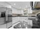 Modern kitchen boasts stainless steel appliances, sleek countertops, and ample cabinet space at 103 S Flagler Ave, Edgewater, FL 32132