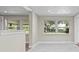 Bright living room with large windows and neutral paint at 103 S Flagler Ave, Edgewater, FL 32132